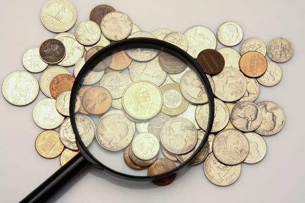 Coins and magnifying glass. Stock Photo by ©Lenets_Tatsiana 44245617
